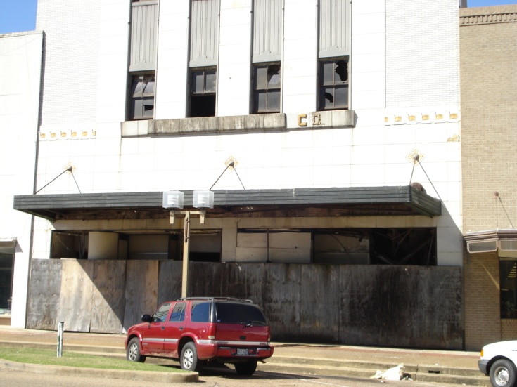 A vehicle sits in front of a building in the Brownfields Program