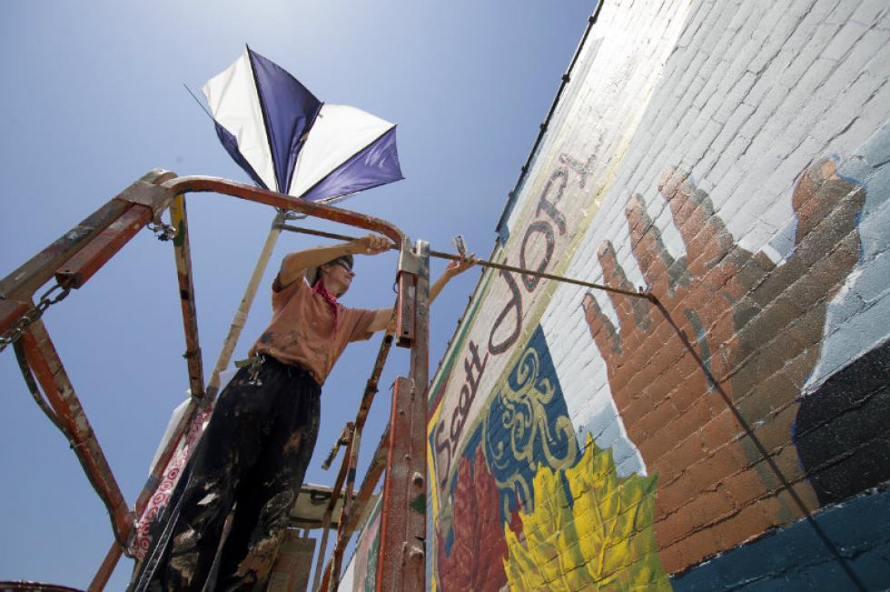Man working on Mural
